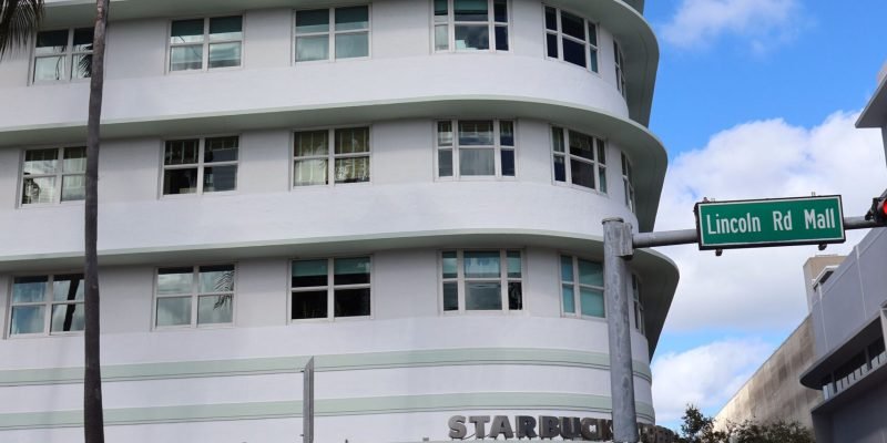 Art Deco architecture on Lincoln Road in Miami Beach with Starbucks storefront.